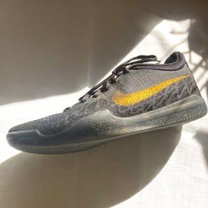 Black and gold Nike shoes for running, biking, walking etc.